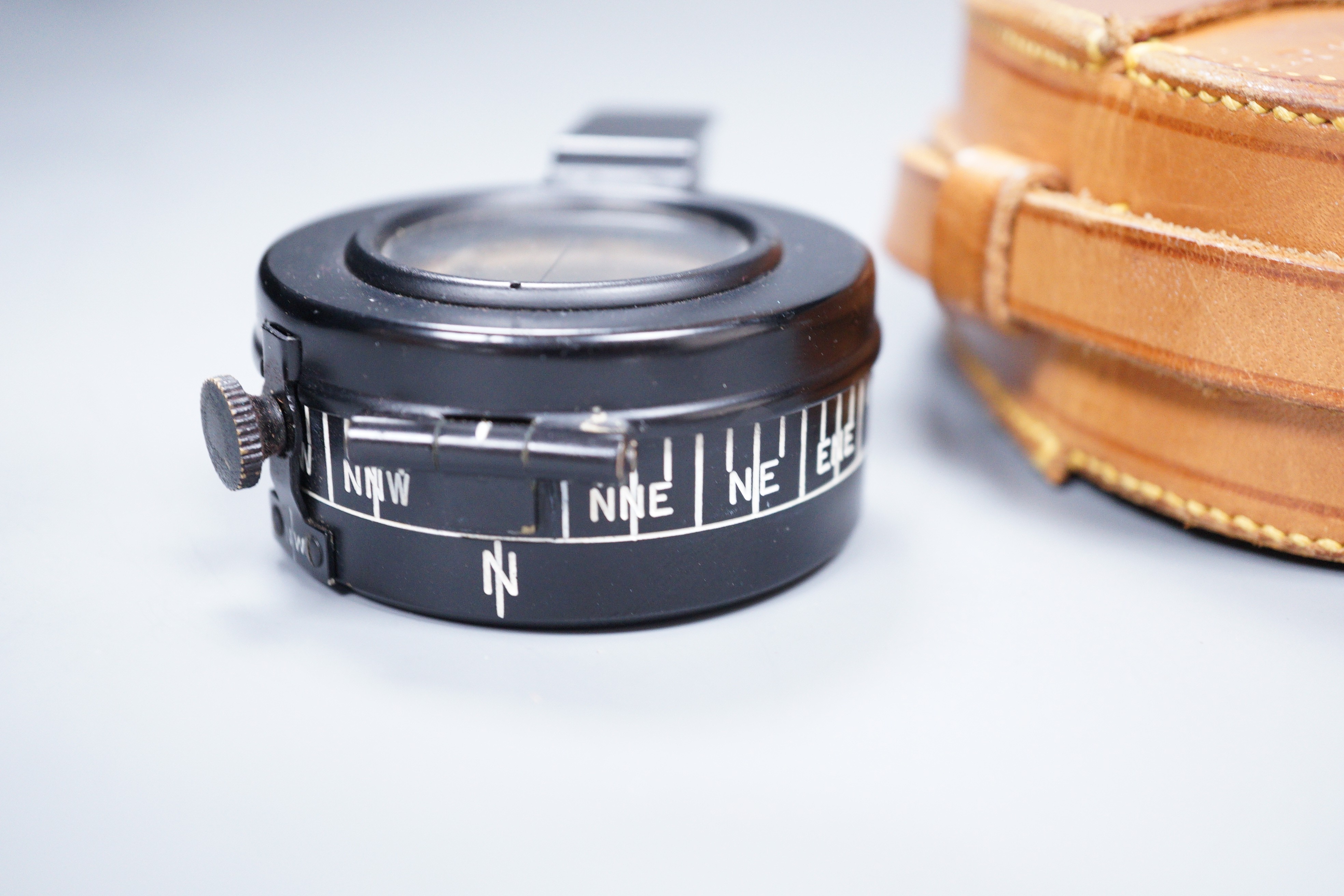 An E.R Watts and Son military compass, 1939 No 3233 MKIII in a leather case